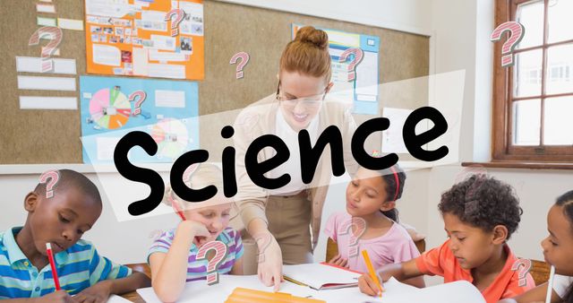 Image of science text and question marks over diverse schoolchildren with teacher in classroom. education, knowledge and school concept digitally generated image.