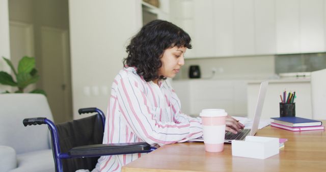 Woman in Wheelchair Working on Laptop in Home Office - Download Free Stock Images Pikwizard.com