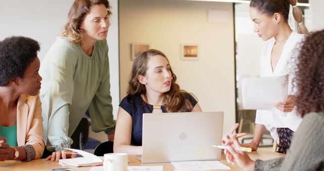 Diverse Group of Businesswomen Collaborating on Project in Office - Download Free Stock Images Pikwizard.com