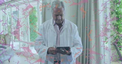 Senior Doctor Using Tablet with Digital Interface in Modern Clinic