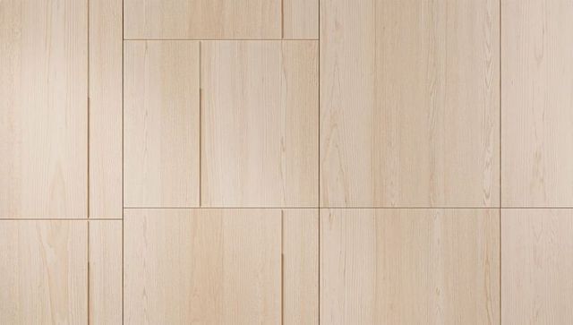Pale wood panel grid with recessed grooves and subtle grain texture for minimalist interior