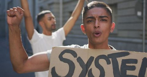 Protesters demonstrating for equal rights holding placards
