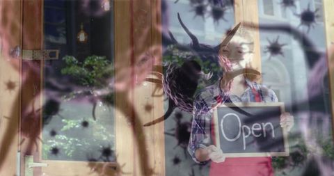 Small business owner holding open sign with infectious agent overlay