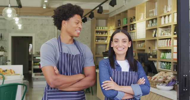 Image of happy diverse female and male waiters at coffee shop. coffee and bistro shop, running small independent business.