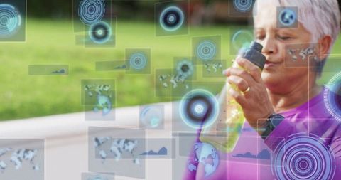 Senior woman drinking on bench with futuristic data displays