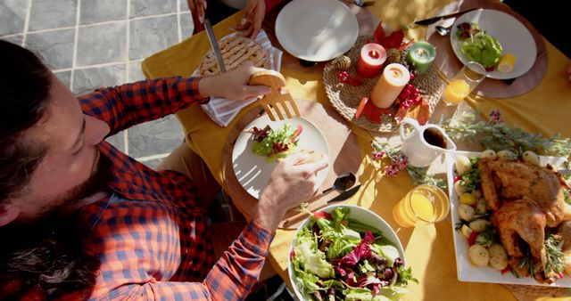 Family Enjoying Outdoor Thanksgiving Dinner with Roast Turkey and Salad - Download Free Stock Images Pikwizard.com