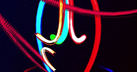 Vibrant Abstract Light Trails Over Dark Background