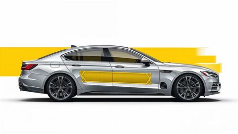 Silver luxury sedan featuring bold yellow door graphic, chrome accents and alloy wheels