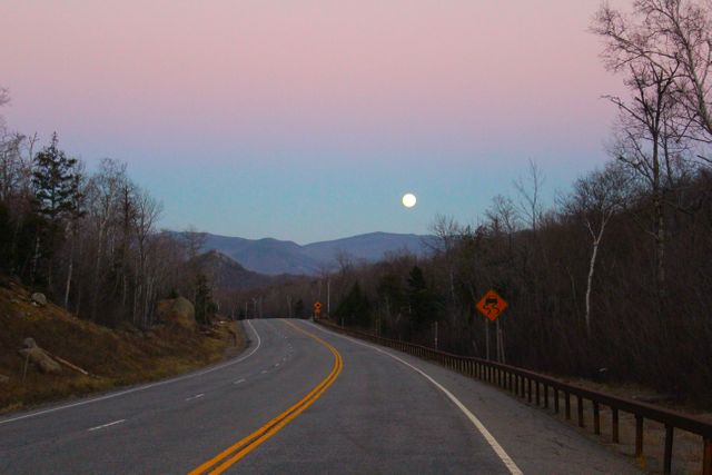 Serene Winding Road at Sunset with Full Moon Over Mountains - Download Free Stock Photos Pikwizard.com
