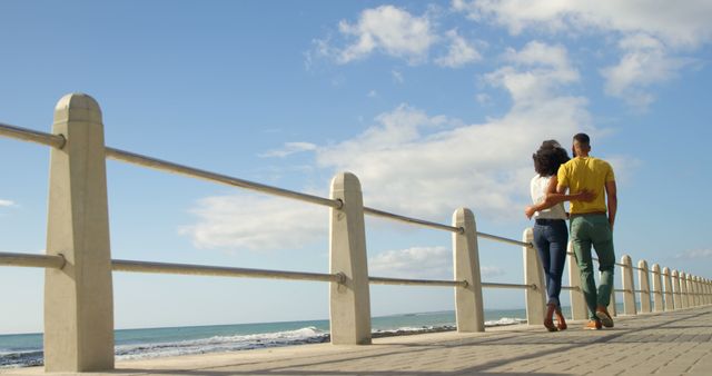 Romantic diverse couple embracing and walking on sunny promenade, copy space - Download Free Stock Photos Pikwizard.com