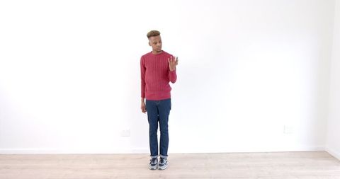 Stylish Young Man Dancing Energetically in Minimalist Room - Download Free Stock Images Pikwizard.com