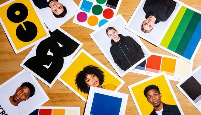 Arranging headshot prints with color swatches for branding, palette testing and model selection