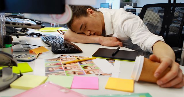 Exhausted Employee Sleeping at Desk with Coffee and Sticky Notes - Download Free Stock Images Pikwizard.com