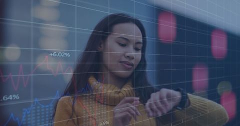 Asian Woman Interacting with Smartwatch Amidst Futuristic Graphics