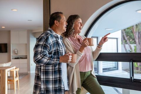 Mature Couple Enjoying Peaceful Moment with Coffee at Home