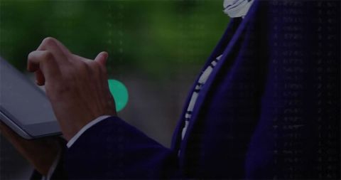 Professional Engaged with Tablet Outdoors