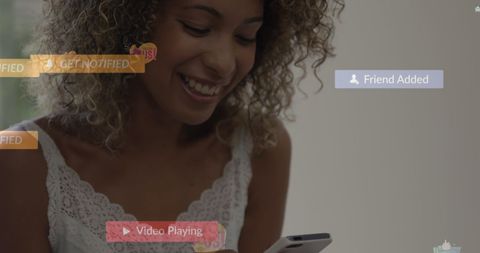 smiling woman receiving social media notifications on smartphone - Download Free Stock Images Pikwizard.com