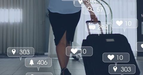 Business traveler walking rolling suitcase through hotel lobby with social media overlays
