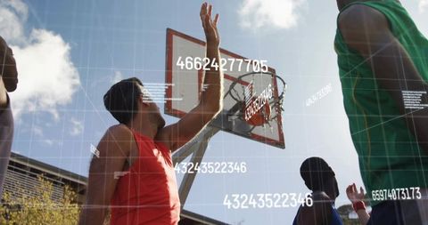 Friends Playing Basketball in Urban Court with Digitized Datapoints
