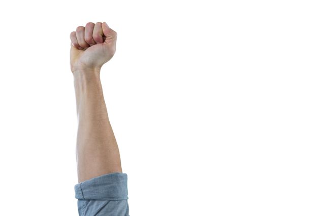 This image of a clenched fist raised in the air symbolizes strength, power, and determination. It can be used in contexts related to protests, activism, solidarity, and empowerment. Ideal for campaigns, motivational materials, and social justice themes.