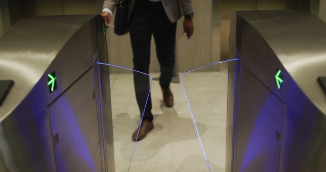 Businessman in Office Attire Walking Through Automated Security Gates - Download Free Stock Images Pikwizard.com