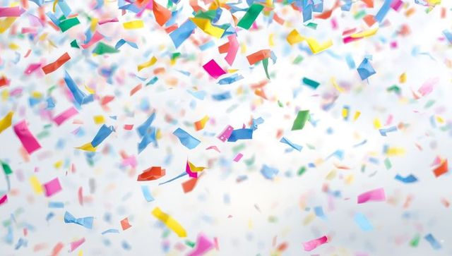 Floating Multicolored Confetti Against White Background