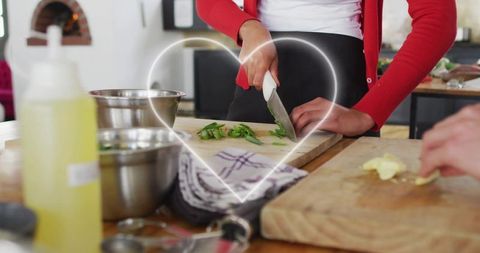 Couple preparing fresh vegetables for a meal in rustic kitchen