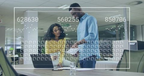 Collaborating on Data Overlay in Modern Workspace, Team Reviewing Analytics Dashboard