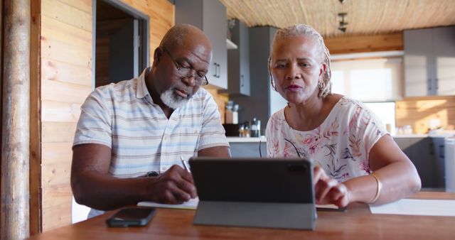 Senior Couple Engaged in Online Banking at Home - Download Free Stock Images Pikwizard.com