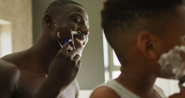 Father Teaching Son to Shave in Bathroom Mirror Reflection - Download Free Stock Images Pikwizard.com