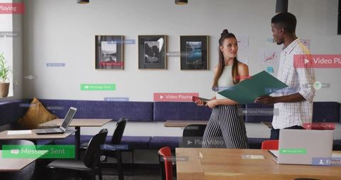 Young professionals collaborating in modern coworking lounge with digital ui overlays