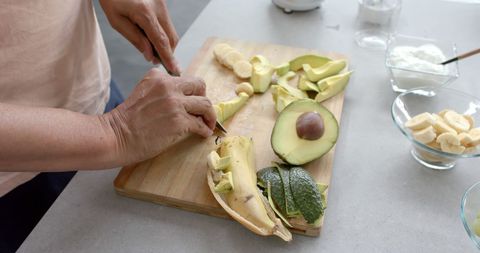 Senior Preparing Fresh Ingredients for Healthy Smoothie
