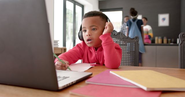 Focused Young Boy Using Laptop for Online Learning with Headphones - Download Free Stock Images Pikwizard.com