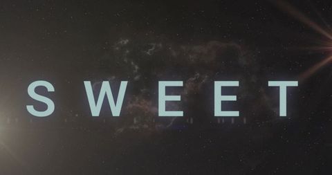 Glowing cyan sweet typography hovering over nebula starfield with cinematic lens flares