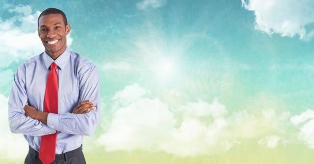 Confident Black Man Smiling with Arms Crossed Against Sky Background - Download Free Stock Photos Pikwizard.com