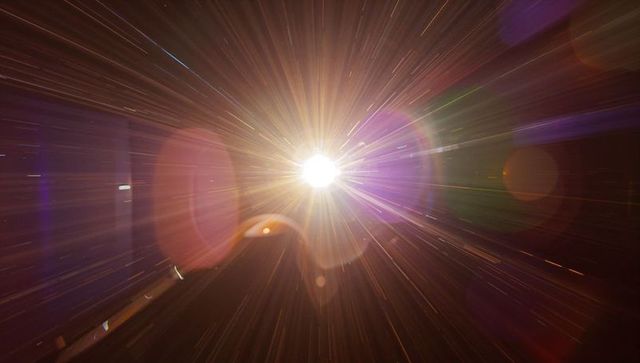 Radiating starburst light beam with lens flare and prismatic bokeh for sci-fi design