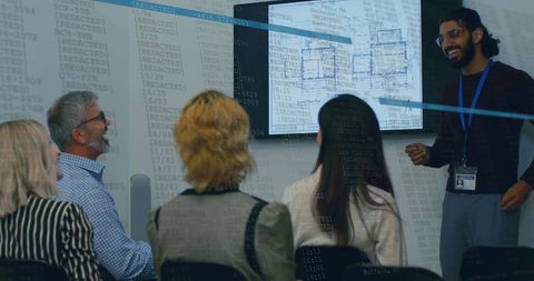 Team Meeting Analyzing Data and Architectural Plans