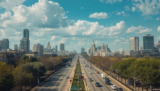 Panoramic urban boulevard leading toward domed landmark and towering modern skyline