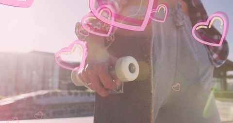 Stylish Young Woman Holding Skateboard at Sunny Skate Park