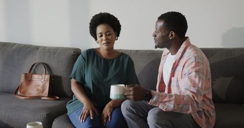 African American Friends Enjoying Coffee and Warm Conversation