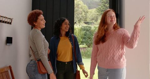 Diverse Group of Female Friends at Home Entryway