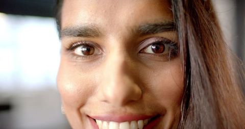 Close-Up of Smiling Woman with Long Hair Showing Bright Expressions