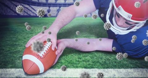 Football player diving touchdown amid virus particles