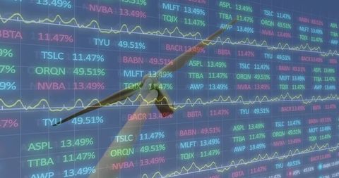 Executive hand pointing at live stock market tickers and realtime analytics dashboard