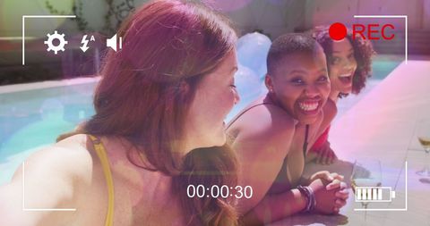Diverse Female Friends Enjoying Sunny Poolside Moment