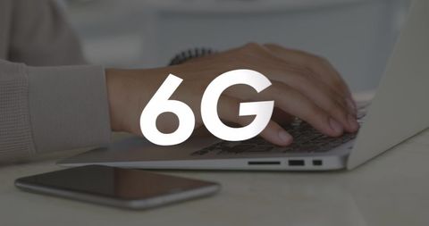 6G Technology Concept with Hands Typing on Laptop