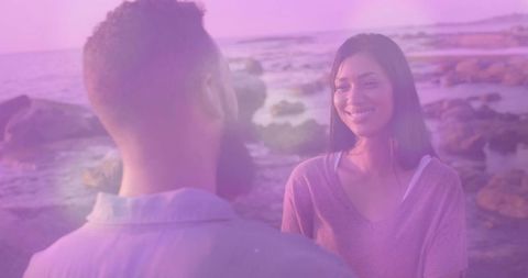 Romantic Couple Enjoying Sunset on Rocky Beach