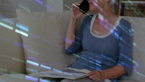 Elderly Woman on Smartphone with Digital Data Overlay