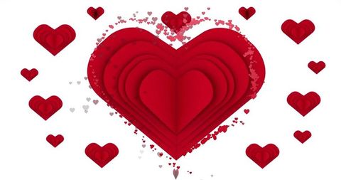 Layered red paper-cut heart with scattered confetti for valentine's day cards and social posts