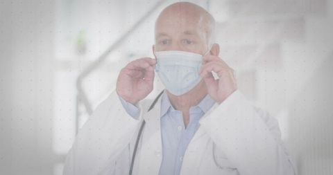 Doctor Adjusting Mask in Hospital Hallway